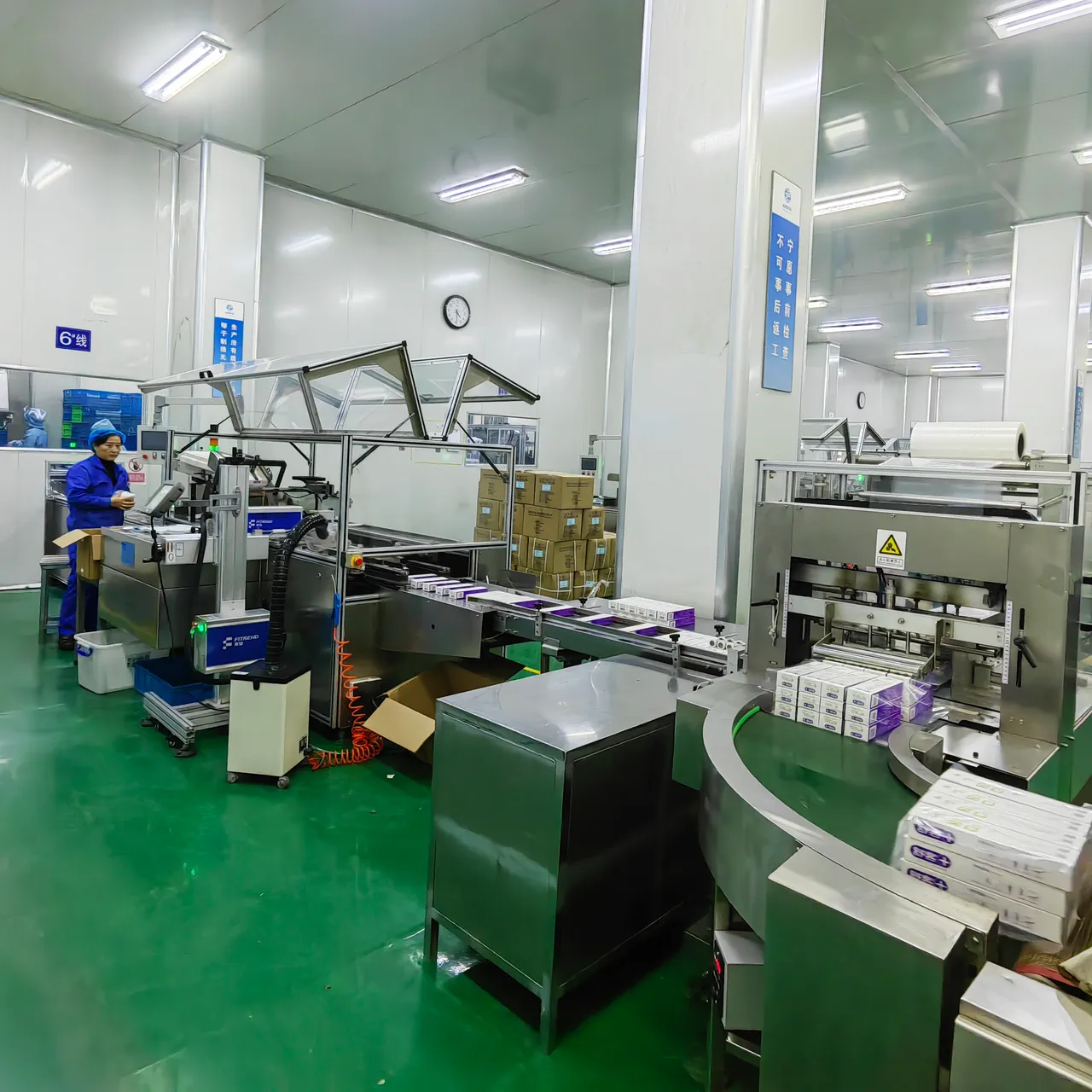 GMP oral-care production floor with stainless-steel mixing vessels